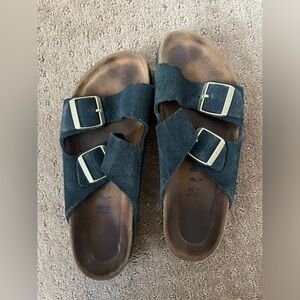 Navy suede Birkenstocks with gold buckle